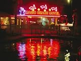 The Magic Beach Motel Sign Reflects in the Motel Pool Photographic Poster Print by Stephen St. John, 18x24