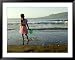 A Girl Walks on the Beach in Jacmel, Haiti, in This February 5, 2001 Associated Press Collection Framed Art Poster Print by Lynne Sladky, 49x39