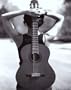Young Woman Holding an Acoustic Guitar Behind Her Back Art Poster Print, 16x20