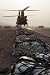 Marine Specialists Attach Sling Loads to the Body of an Army CH-47 Chinook Cargo Heli...