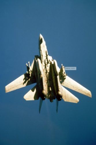Photo An F-14A Tomcat aircraft from Carrier Air Wing 1 (CVW-1) banks into a turn while on a combat air patrol (CAP) near Kuwait during operation Desert Storm. CVW-1 is embarked aboard the aircraft carrier USS AMERICA (CV 66)., 02/01/1991