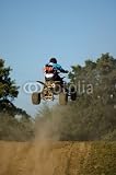 Wallmonkeys Peel and Stick Wall Decals - Teenager on a Yellow Quad Bike Jumping - Removable Graphic
