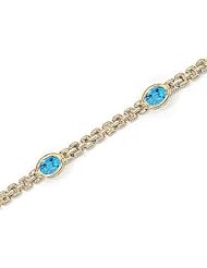 14kt Yellow Gold Oval Blue Topaz Bracelet.
