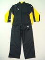 Puma V-Kon Woven Suit Kinder Trainingsanzug / Jogginganzug schwarz/gelb