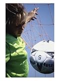 Girl Standing in a Goal Looking at a Soccer Ball Photographic Print, 30 x 40