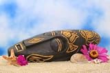 Wooden Mask on Sand with Flowers and Blue Sky Background - 24