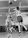Young Boy Shooting a Free-Throw Shot over the Head of Another Young Boy Photographic Poster Print, 12x16