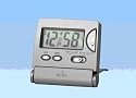 Acctim Travel Alarm Clock. Silver case, LCD display,alarm, light, Snooze button Folds flat for packing. Batteries included.
