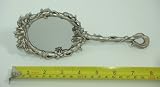 Floral Design Hand Mirror -2 1/2 x 3 1/8 Inch Oval Mirror Surface. Overall Length: 8 Inches