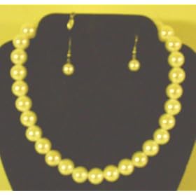 Click here to buy Imported Ivory Pearl Short Chain Necklace and Matching Earrings for Women and Teens by Gita.