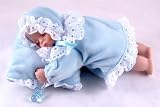 Charming Baby on Cushion musical box - dressed in blue