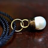 Sea Stone Pendant - white pearl wire wrapped in bronze with black cord