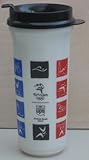 IMAGE OF Collectible Plastic Ivory Travel Drinking Coffee / Tea Mug Cup with UPS and Sydney 2000 Worldwide Olympic Partner printed in brown with brown plastic lid for straw / has Olympic symbols in blue, brown, orange and green squares - 22 oz - 7 3/4 inches tall x 3 1/4 inches in diameter