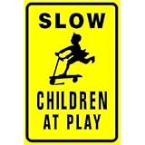 SLOW CHILDREN PLAYING yellow street sign