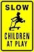SLOW CHILDREN AT PLAY warn street park sign
