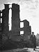 Boy Whose Left Leg Was Crushed in an Air Raid, Walking Down the Streets of the Ruined...