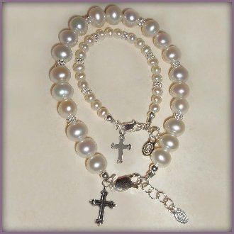 Mom and Me, Sterling Silver Bracelet Set for mother and daughter. This beautiful keepsake uses lead-free crystals and beautiful freshwater pearls with coordinating cross charms. Mother's bracelet is adjustable 7-71/2