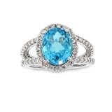 14k Gold Split Shank Ring with 0.85ct of diamonds and holds an 11x9mm Blue Topaz Center