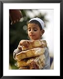 A Boy Carries Rusk as He Assists Others to Send a Consignment of Relief Supplies to Uri Photography Framed Art Poster Print, 25x31