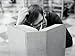 Man Sitting at Library Table, Scratching Head, With Large Book Open in Front of Him Photographic Poster Print by H. Armstrong Roberts, 24x32