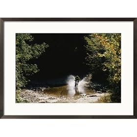 Mountain biker splashing through water at high speed, Canaan Valley Photography Framed Art Poster Print by Skip Brown, 29x21