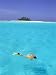 Woman Snorkelling at Sea Surface,Cocos Keeling Island in Background, Indian Ocean, Australia Art Photographic Poster Print by Jurgen Freund, 12x16