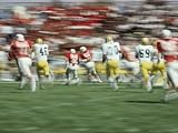 Panned Shot of a Ball State University Football Game against Eastern Michigan University Photographic Poster Print by Brian Gordon Green, 64x48