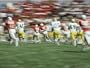 Panned Shot of a Ball State University Football Game against Eastern Michigan University Photographic Poster Print by Brian Gordon Green, 64x48