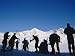 Putting on Skis, St. Anton, Austria Art Photographic Poster Print by Neil Emmerson, 12x9