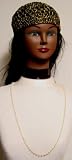 Off White Small Ivory and Amber Pearl Long Chain Necklace and Eye Glass Holder Offered in Combination with Hand Crocheted Black Chenille and Gold Gimp Tweed Skull Cap