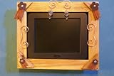 Voclan 8LCD by SHARP.Includes rustic handmade wood frame with leather and copper accents. The ONLY ONE that fits most 8x10 picture frames for future decor changes.Play MP3 & Video in stereo.Includes US shipping for limited time.