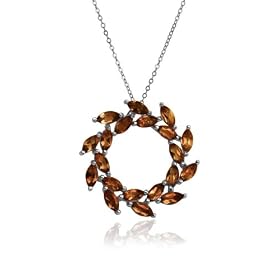 Sterling Silver Garnet Leaf Design Circle Pendant by Amazon.com Collection