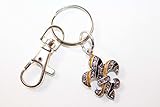 From the Heart Beautiful Black & Gold Fleur de Lis Key Chain. Fleur de Lis is Embellished with Clear Rhinestones. Celebrate Louisiana Recovery,The New Orleans Saints Football Team, Drew Brees,& The Rebirth of New Orleans with Lots of Bling!!!!!