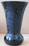 Decorative Porcelain Black Floral Vase - 10 inches tall x 4 1/2 inches in diameter. Has imaged etched in the surface. The image is of some plants and a castle or asian garden