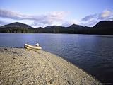 IMAGE OF An Inflatable Boat Rests on a Pebbly Shore Premium Photographic Poster Print, 18x24
