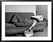 Writer Niven Busch Lying on Sofa with Newspaper over His Face as He Takes Nap from Screenwriting Framed Art Poster Print by Paul Dorsey, 39x31
