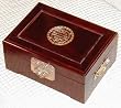 Rosewood jewelry box with brass longevity symbol