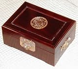 Rosewood jewelry box with brass longevity symbol