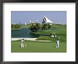 dubai creek Men on Dubai Creek Golf with Yacht Club in Distance, Dubai, United Arab Emirates Photography Framed Art Poster Print by Holger Leue, 22x18