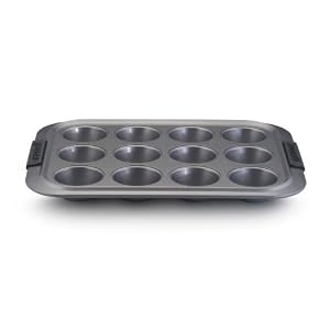 Click here to buy Anolon Advanced Bakeware 12-Cup Muffin Pan by Anolon.