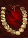 Enlarged Holes in the Golden Discs of a Restored Necklace Indicate Long Wear by the W...