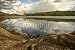 Wallmonkeys Peel and Stick Wall Decals - Fishing Rod Placed on the Ground near a Lake Outdoors at a Recr - Removable Graphic