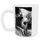 Woman changing a horses shoe while working.. - Mug - Standard Size