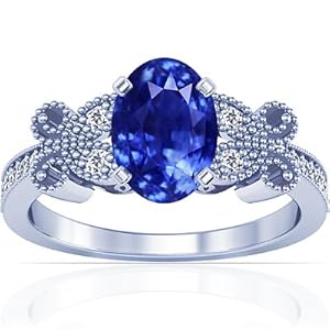 Platinum Oval Cut Blue Sapphire Ring With Sidestones