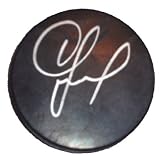 Igor Larionov Autographed Black NHL Puck W/PROOF, Picture of Igor Signing For Us, Detroit Red Wings, Stanley Cup Champions