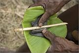 canvas Ears and tail of just-slaughtered pig cut off with traditional bamboo knife, to be taken i...