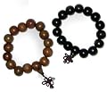 Asian wrist malas - pair of carved buddha meditation prayer beads - wood