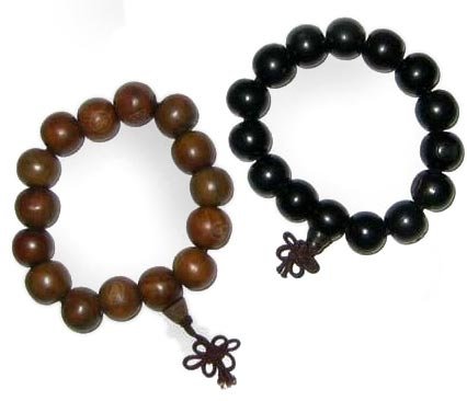 Asian wrist malas - pair of carved buddha meditation prayer beads - wood