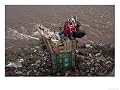 A Truck Lays Wrecked on the River Bank of the Jhelum River Photographic Print, 24" x 18"
