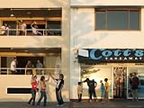 People Outside Cott's Takeaway, Cottesloe Beach Photographic Poster Print by Orien Harvey, 32x24